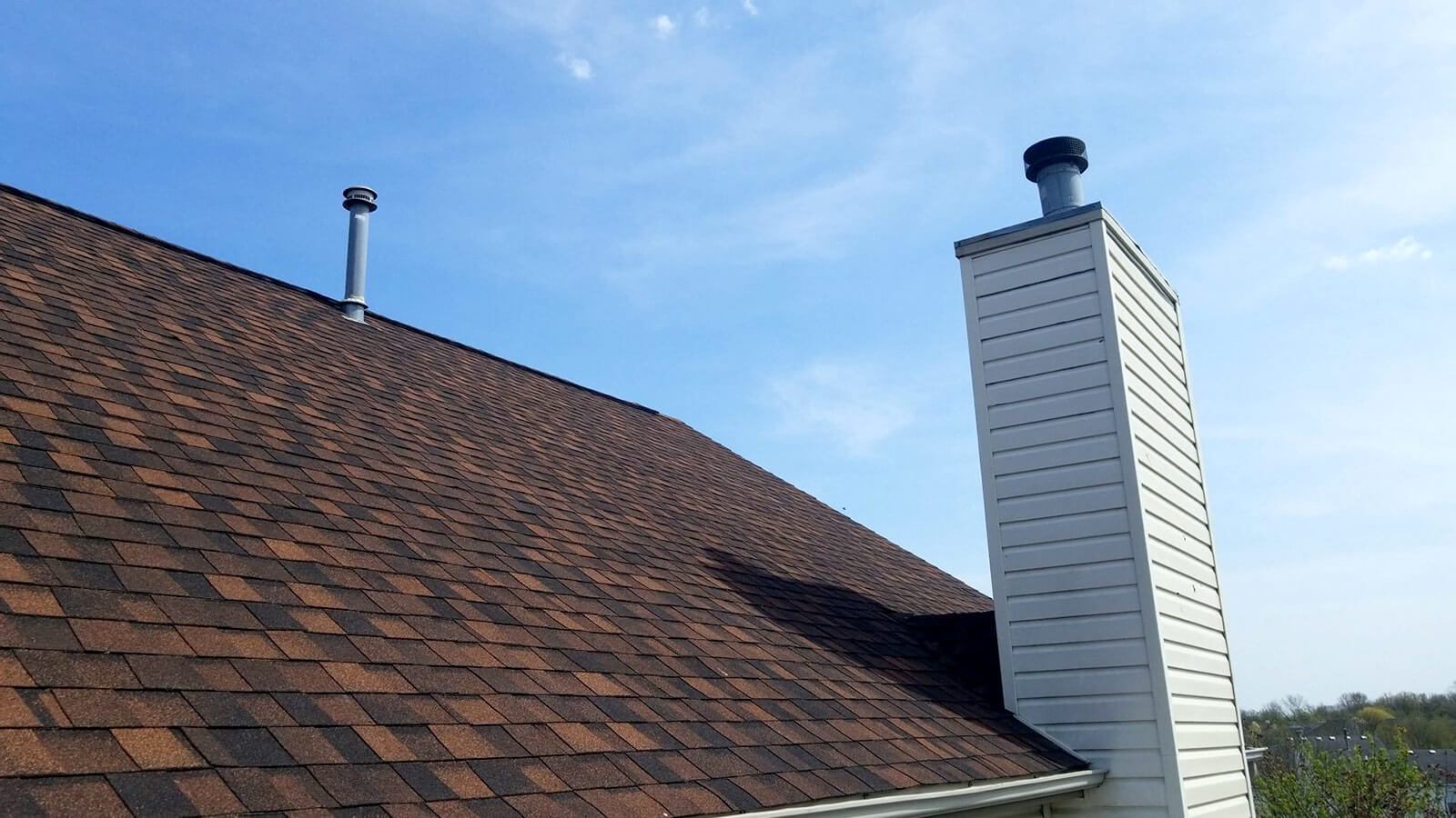 A residential roof installed by Renowned Building Solutions