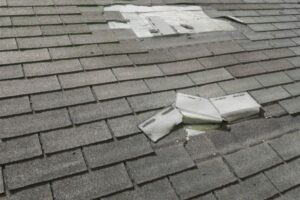 Evidence of storm damage on a residential roof